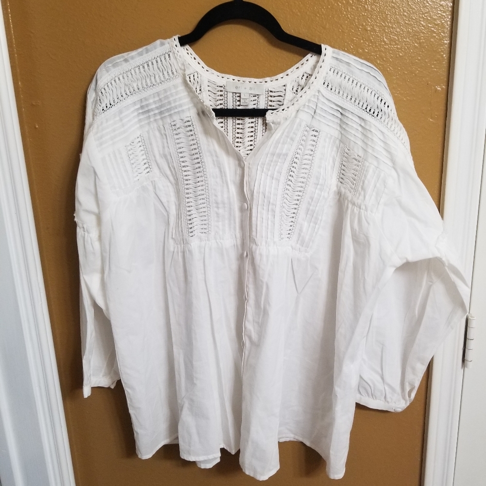 White blouse with detailed lacing and buttons